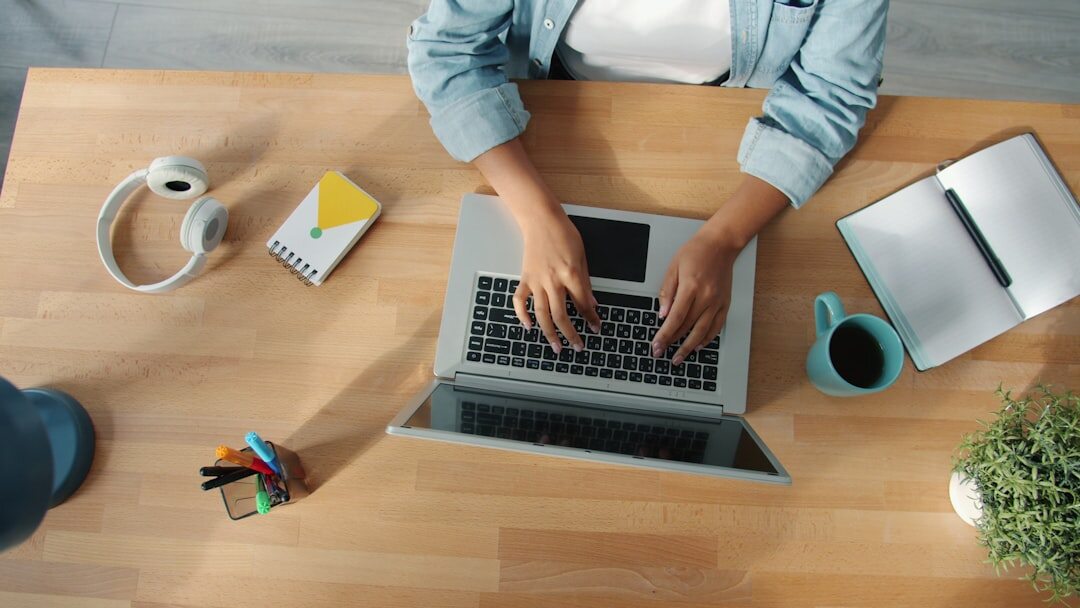 person typing on laptop
