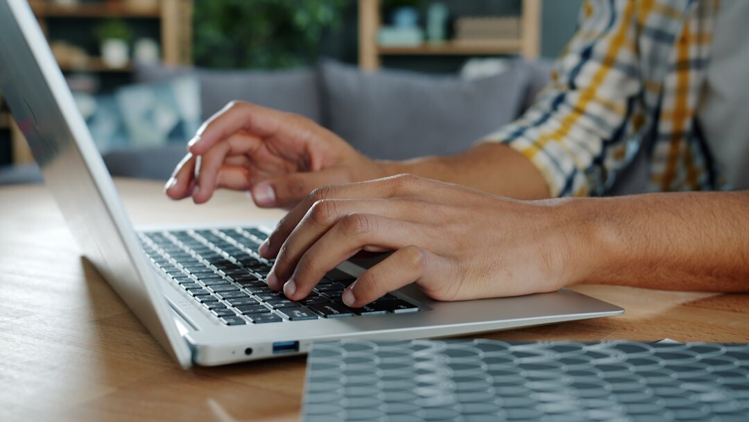 person typing on laptop
