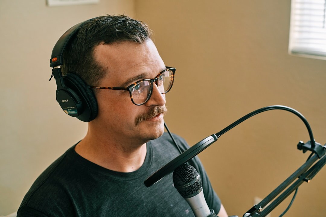 person setting up podcast microphone