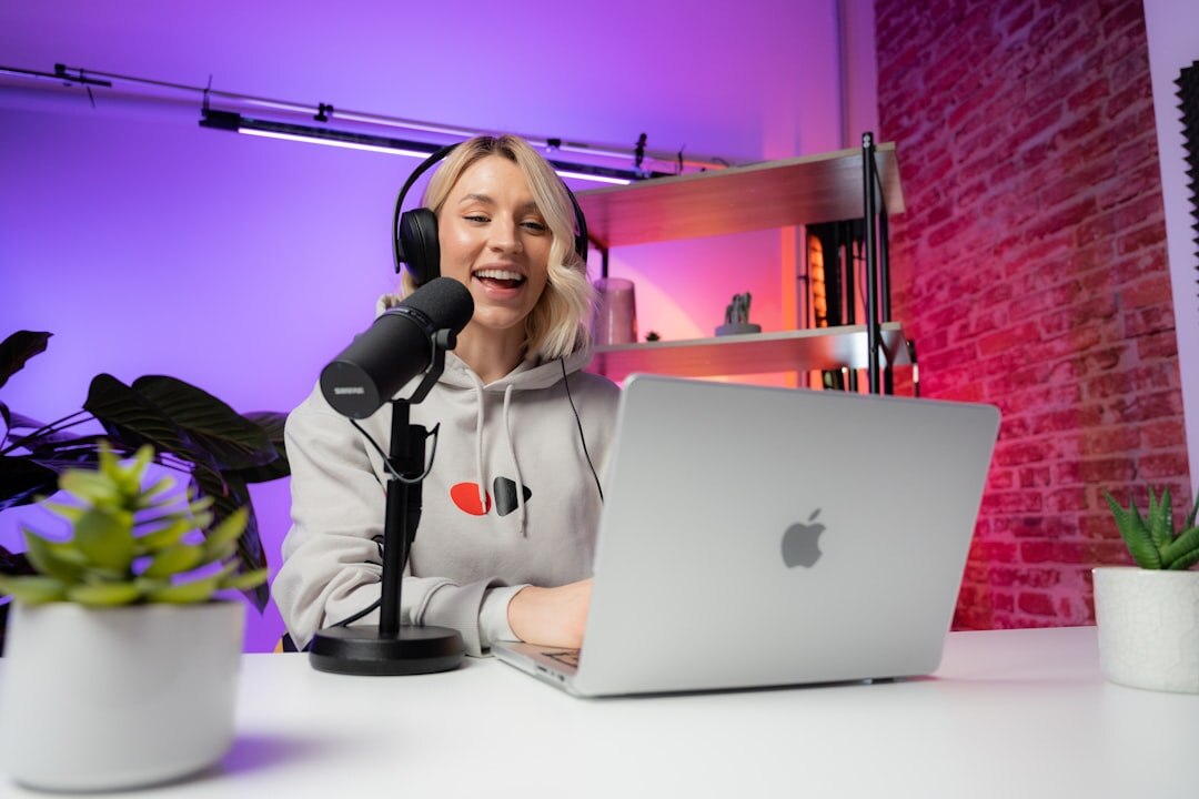 person editing audio on laptop